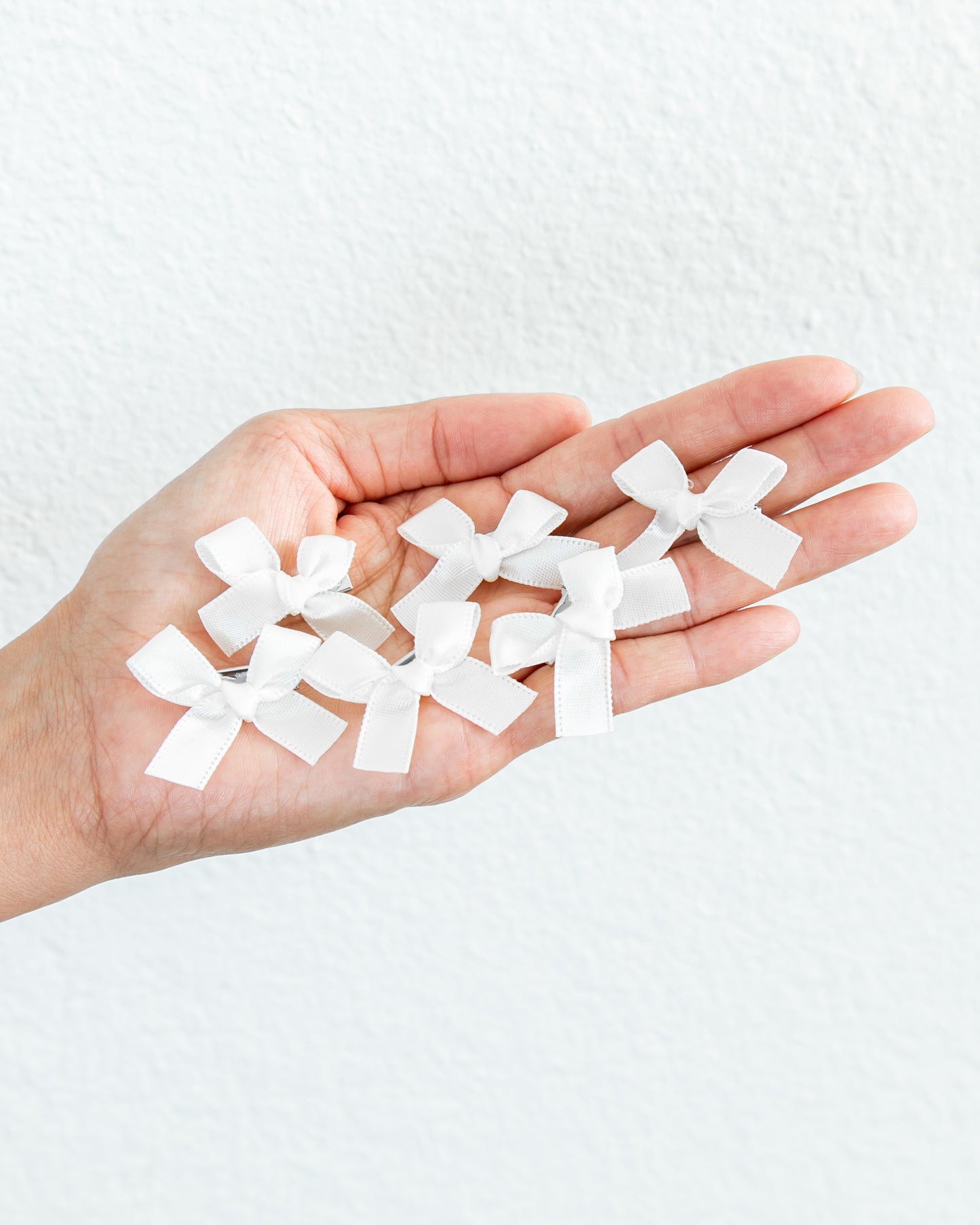 CHRISTINE GARCIA 6-Piece Mini Bow Clips in White